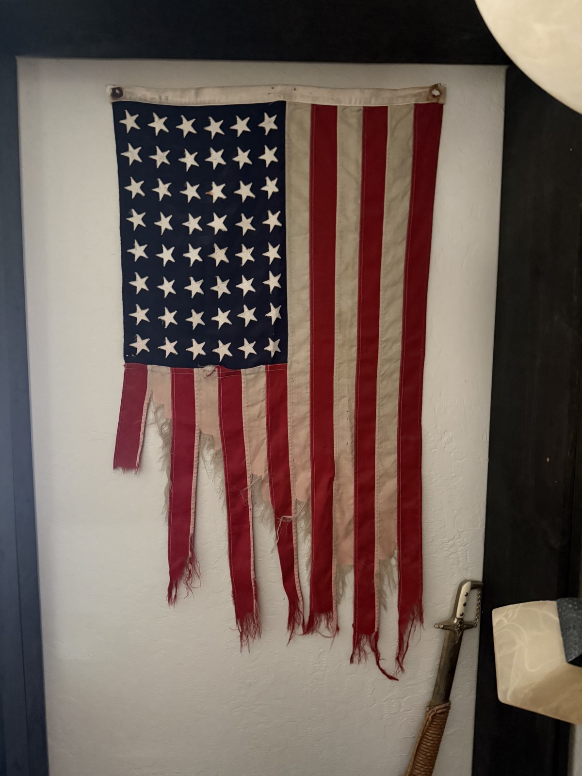 A vintage 48-star American flag, kept by the family