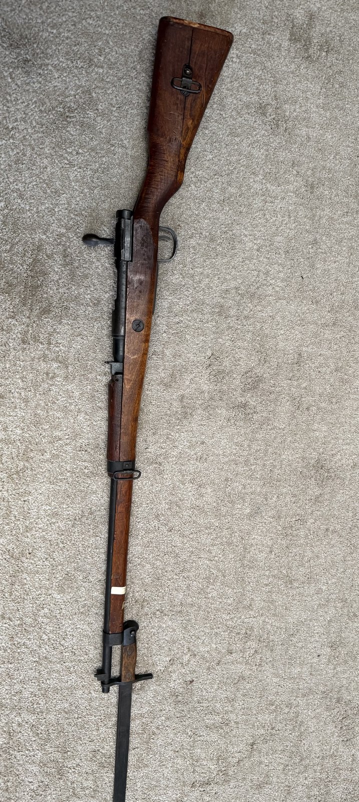 A rifle with fixed bayonet, kept among the family's collection of keepsakes