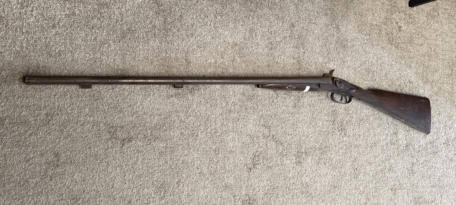 An antique double-barrel shotgun, kept among the family's collection of keepsakes