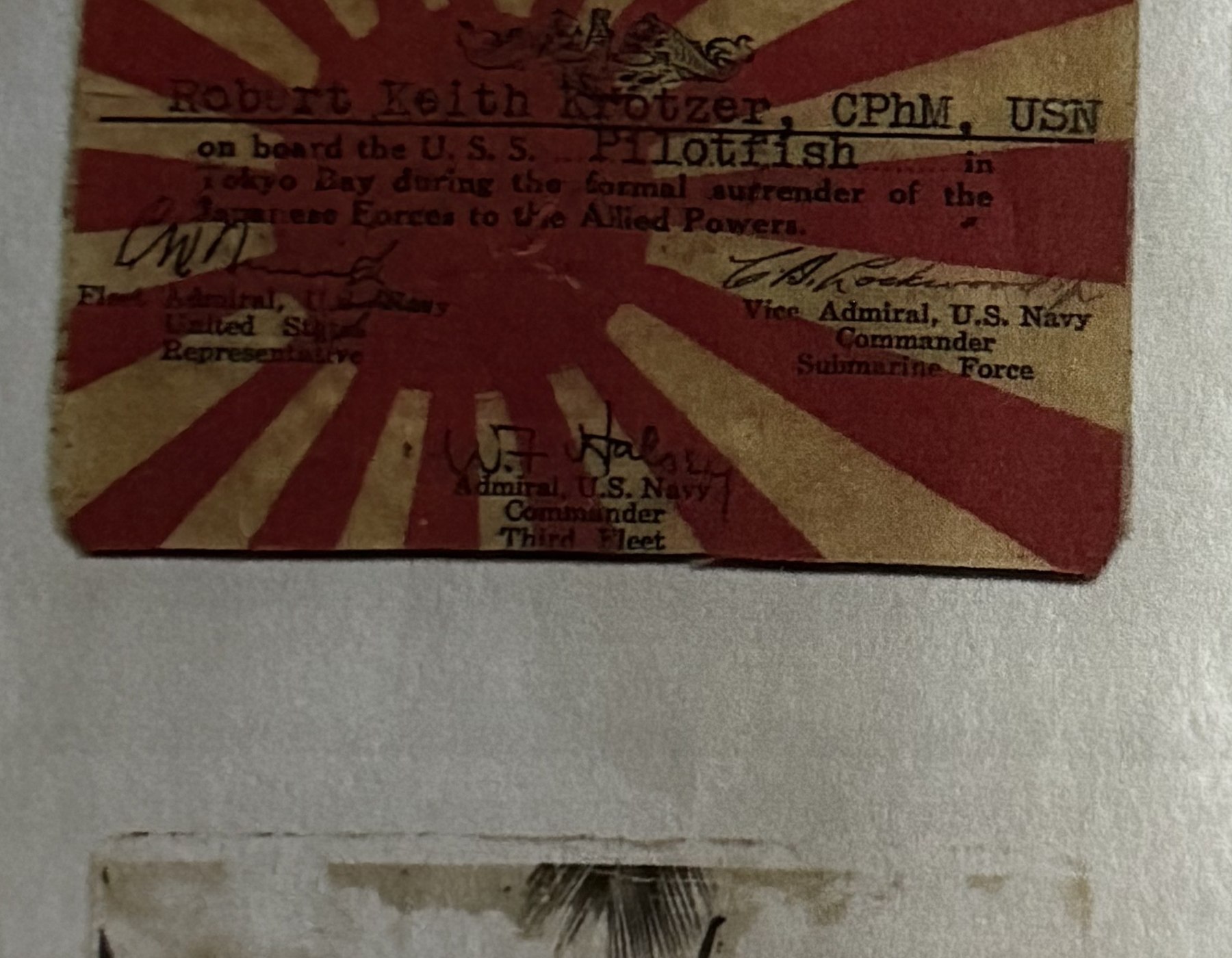 Card certifying Robert Keith Krotzer's presence aboard USS Pilotfish for the Japanese surrender, signed by Fleet Admiral Nimitz, Vice Admiral Lockwood, and Admiral Halsey